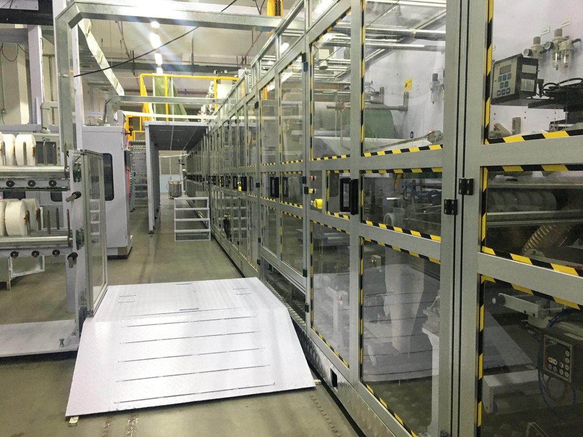 ISO 13485 certified adult diaper production cleanroom corridor — 100,000-class facility